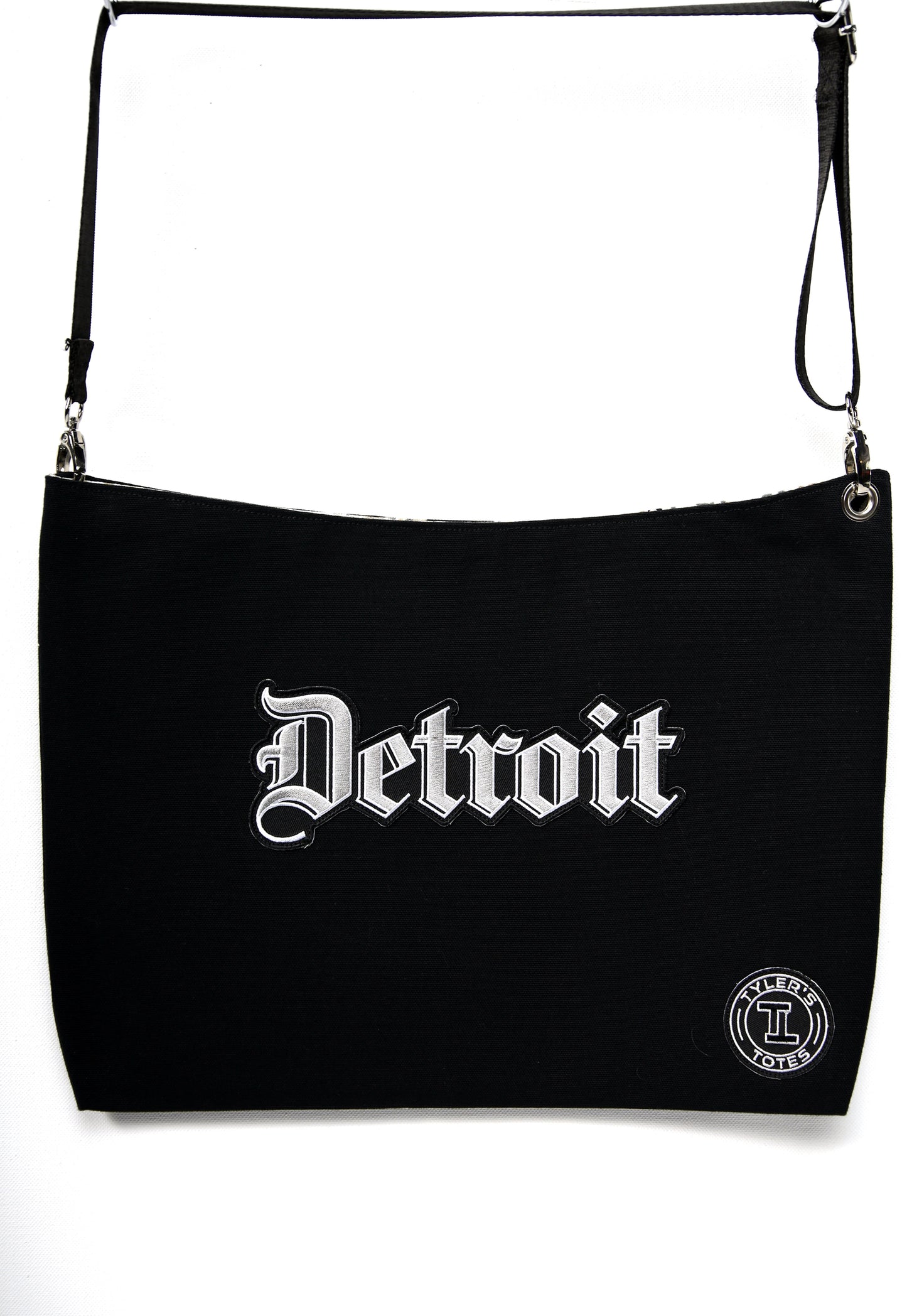 Black square tote with "Detroit" patch in Old English font.