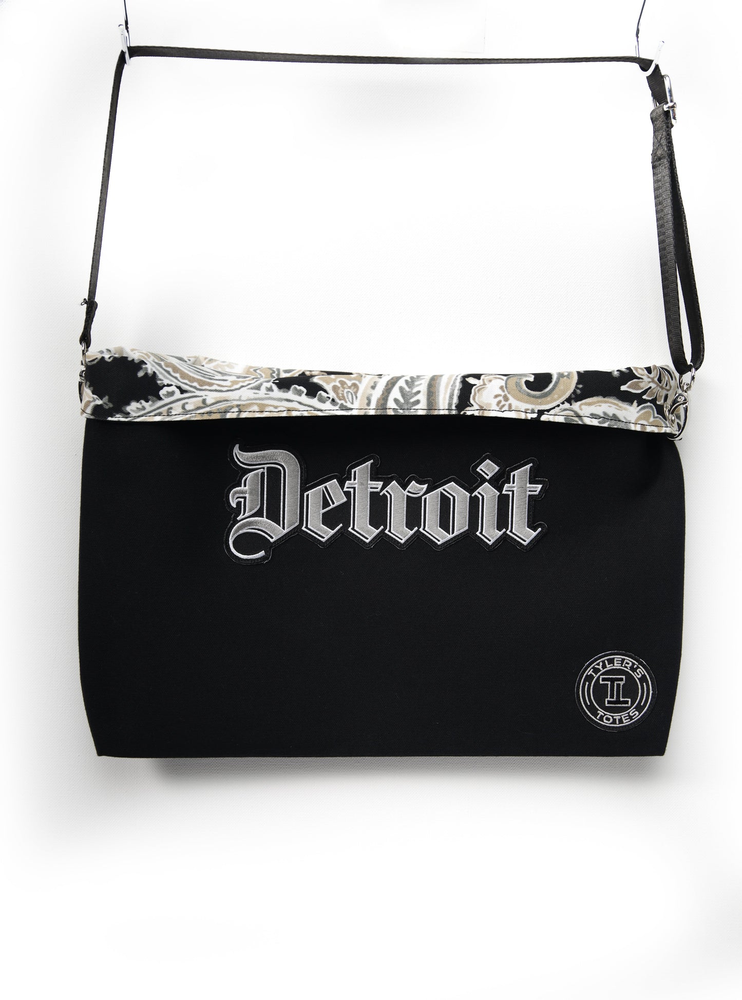 Black square tote with "Detroit" patch in Old English font and paisley interior.