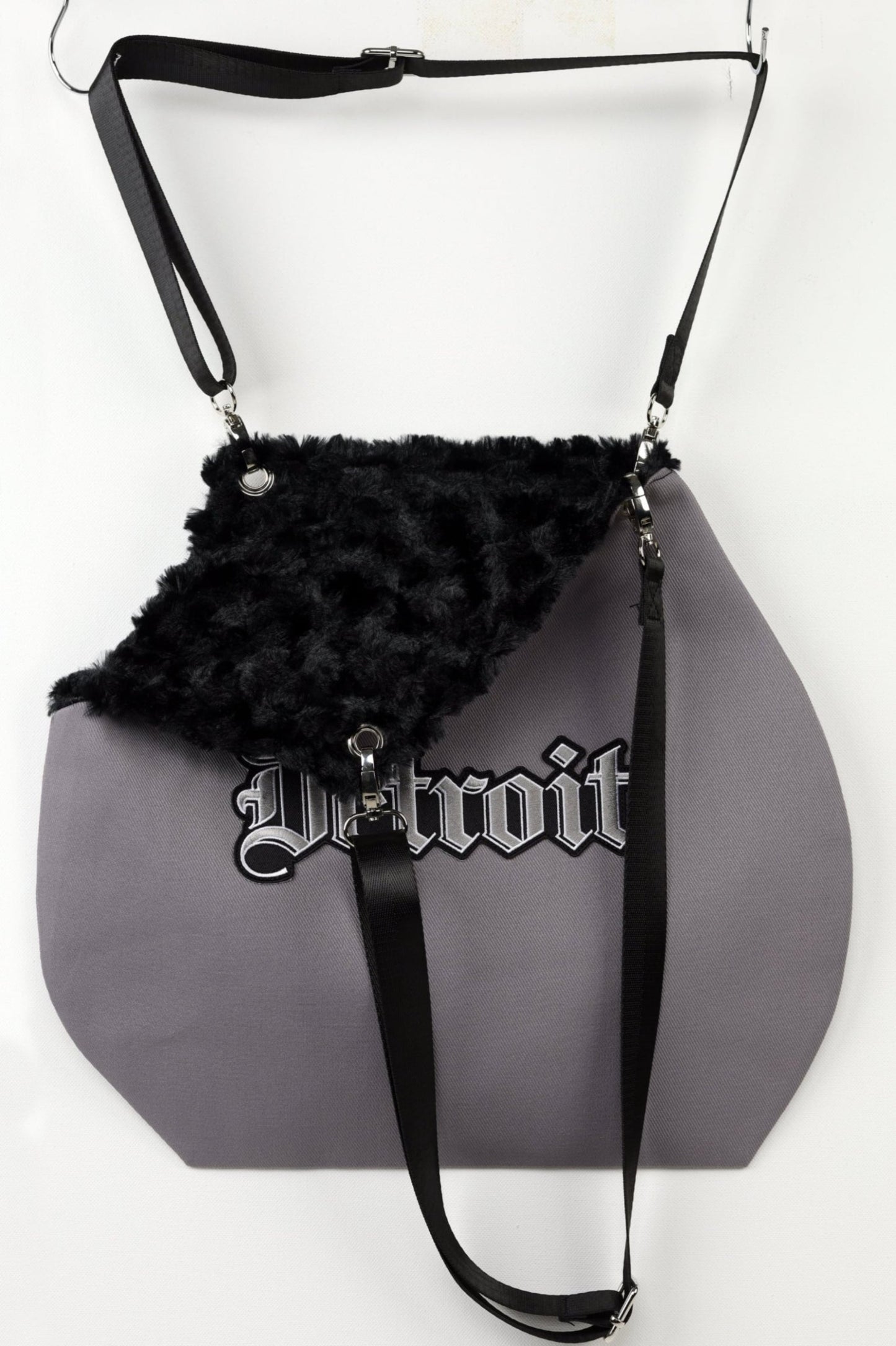 Faux fur lined pet carrier tote.