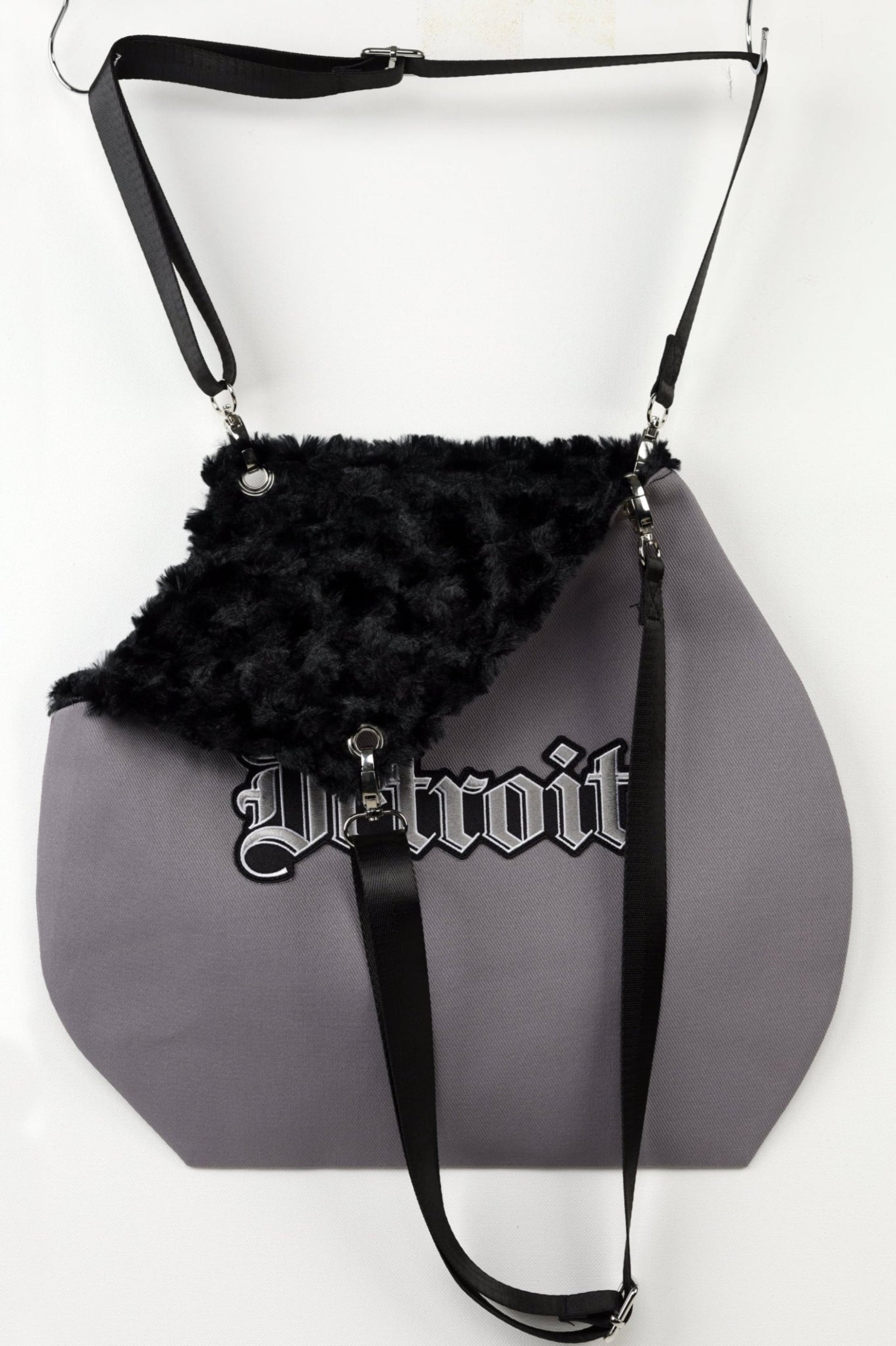 Faux fur lined pet carrier tote.