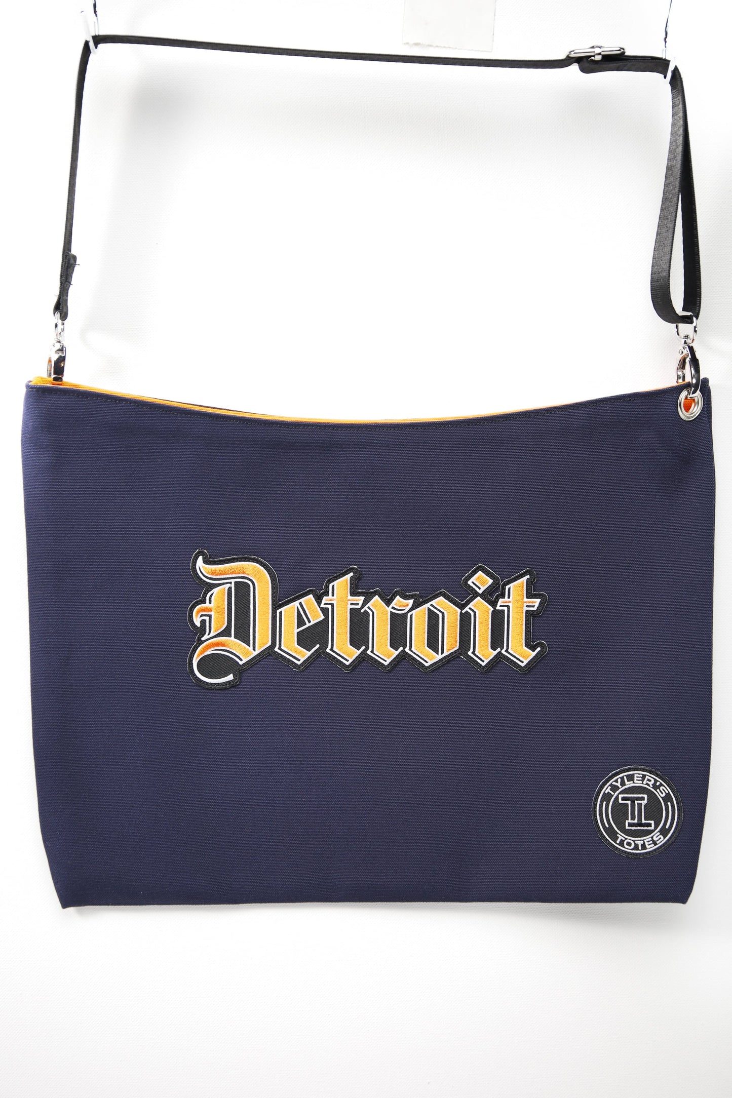 Navy blue bag with 'Detroit' text and a logo on a white background