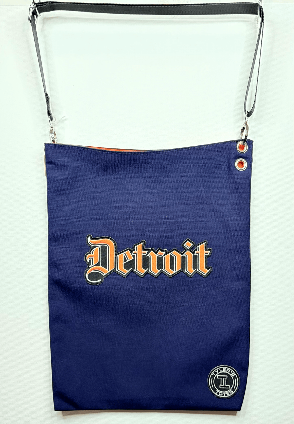 Navy Blue Deroit Messenger tote with orange Detroit patch and orange lining
